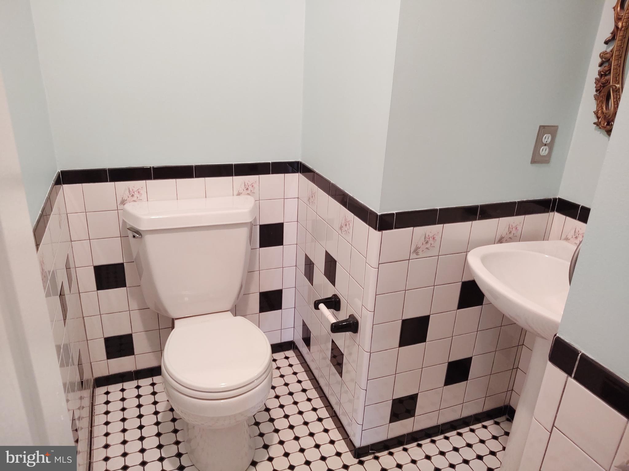 609 Mann Road Deale, MD 20751 - Photo 8 of 24 a bathroom with a toilet and a shower