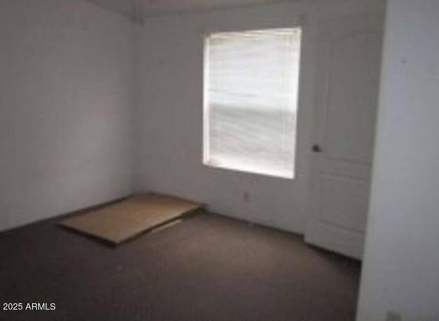 1495 Buffalo Run Road Chino Valley, AZ 86323 - Photo 12 of 20 an empty room with a window