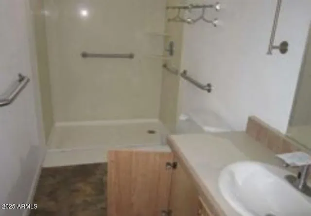 a bathroom with a tub and a shower