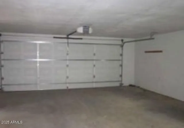 a view of backyard with deck and wooden fence