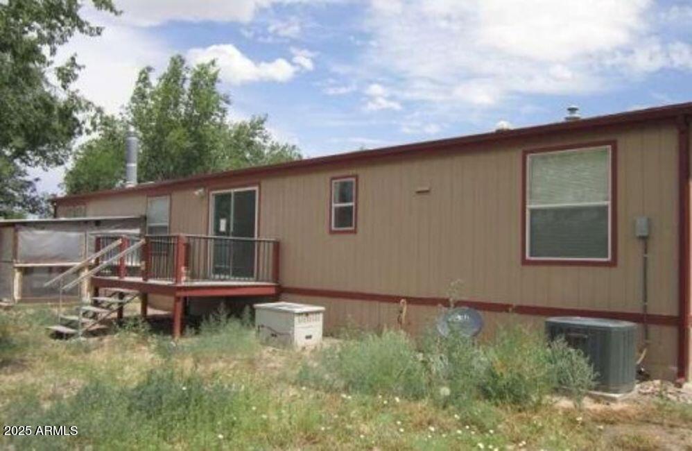 1495 Buffalo Run Road Chino Valley, AZ 86323 - Photo 2 of 20 a backyard of a house with table and chairs