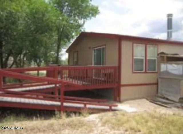 a view of front door and small yard