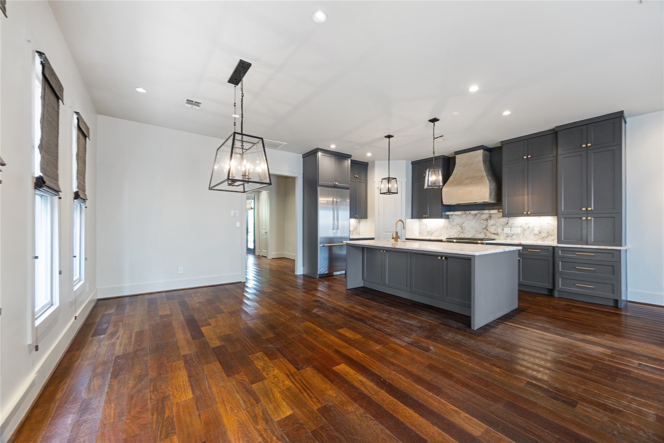 926 Nicholson Street Houston, TX 77008 - Photo 11 of 39 Wide-plank Brazilian hardwood floors and oversized windows bring warmth and natural light throughout the ground floor living and entertaining spaces.