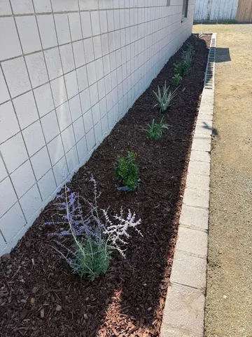 a lobby with furniture and a rug