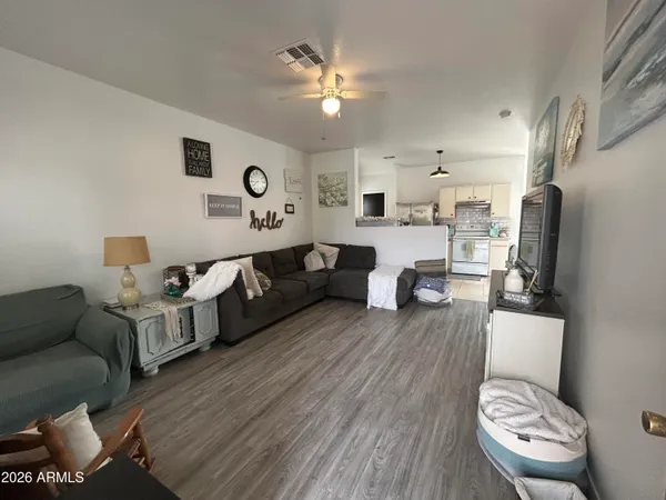 a living room with furniture and a flat screen tv
