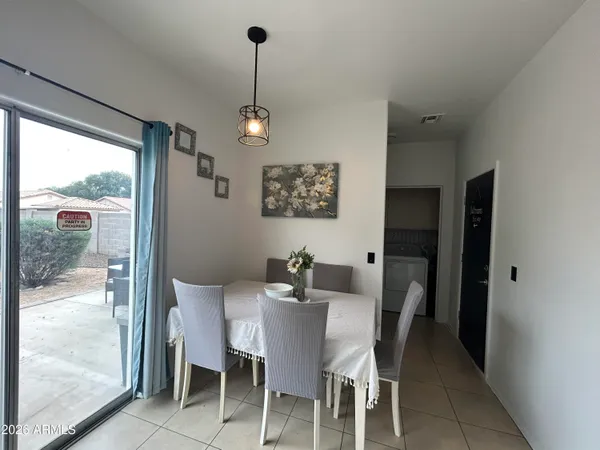 a view of a dining room with furniture window and outside view