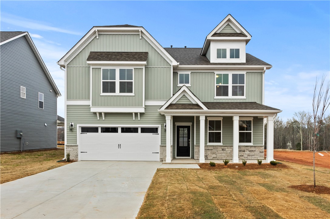 134 Anderson Oaks Lane, Unit 84 Easley, SC 29642 - Photo 1 of 43 This charming residence features a classic exterior and inviting entryway, perfect for welcoming guests.