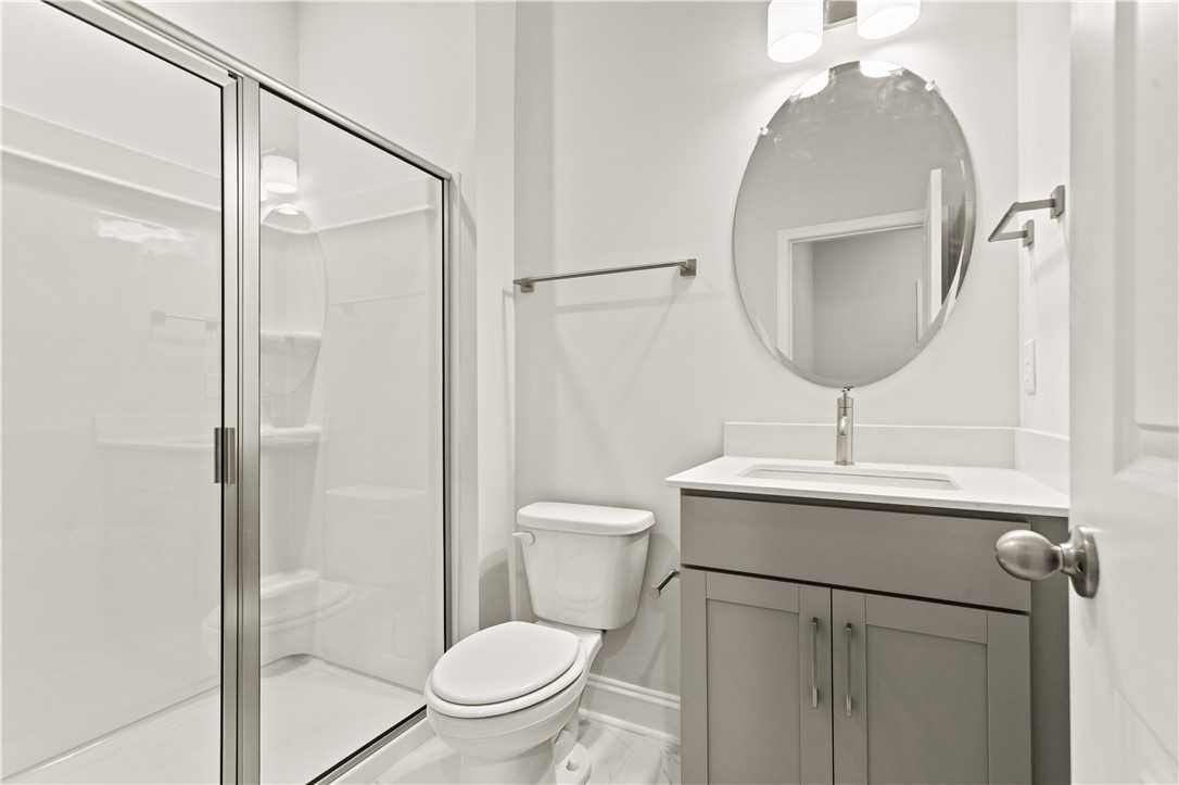 134 Anderson Oaks Lane, Unit 84 Easley, SC 29642 - Photo 17 of 43 This bright bathroom features a sleek vanity and a spacious walk-in shower.
