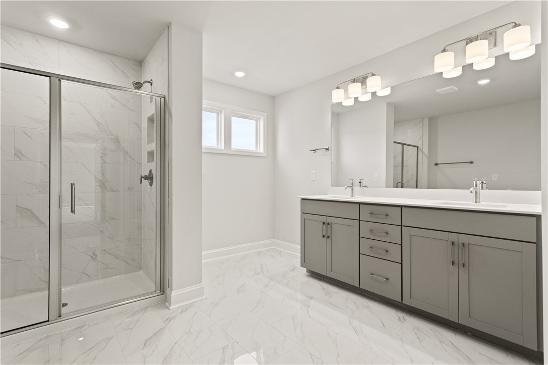 134 Anderson Oaks Lane, Unit 84 Easley, SC 29642 - Photo 25 of 43 This modern bathroom features a spacious shower and elegant double vanity with ample storage.