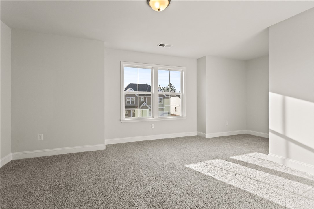 134 Anderson Oaks Lane, Unit 84 Easley, SC 29642 - Photo 27 of 43 Bright and airy, this room provides a blank canvas for personalization with ample natural light.