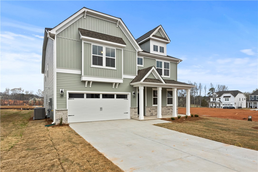 134 Anderson Oaks Lane, Unit 84 Easley, SC 29642 - Photo 3 of 43 This newly constructed home features a two-car garage and a welcoming front porch.