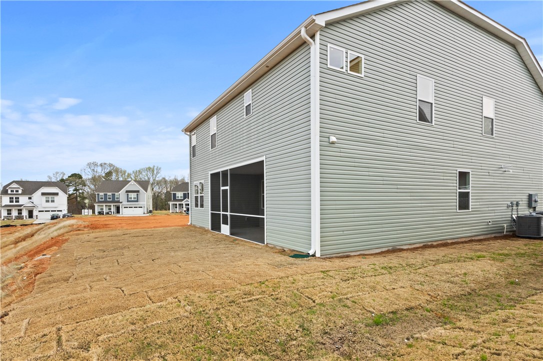 134 Anderson Oaks Lane, Unit 84 Easley, SC 29642 - Photo 34 of 43 This home features a screened porch and a spacious yard, perfect for outdoor enjoyment.