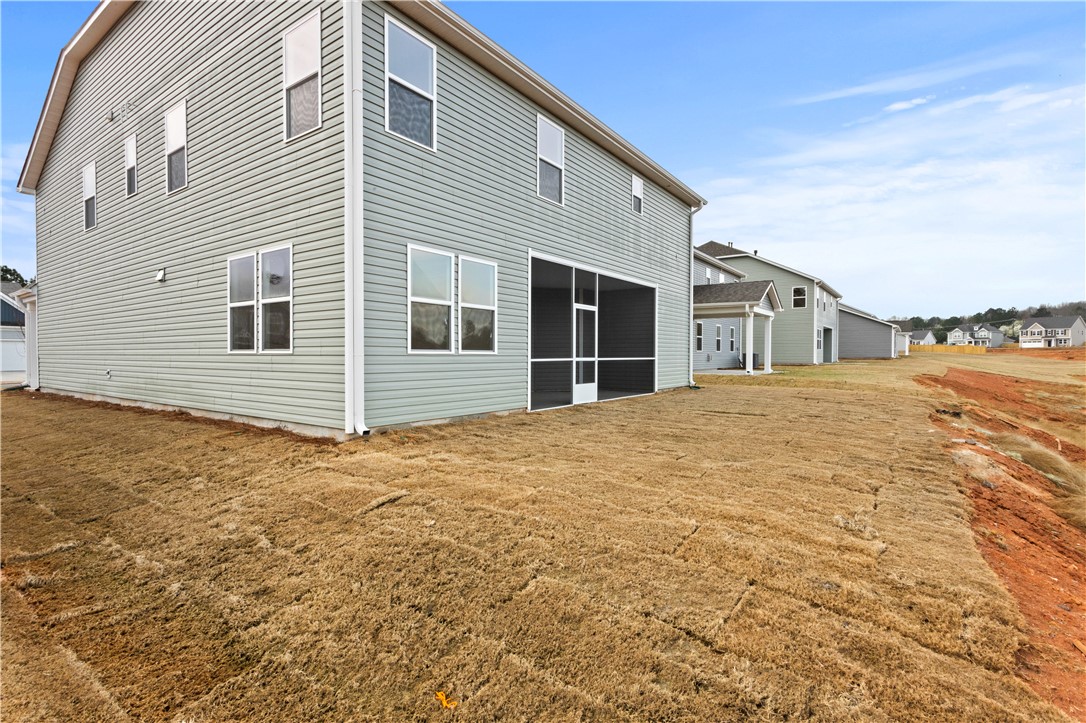 134 Anderson Oaks Lane, Unit 84 Easley, SC 29642 - Photo 35 of 43 This modern home features clean lines and a screened porch, ideal for comfortable outdoor living.