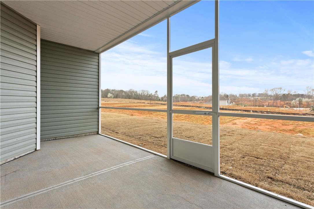 134 Anderson Oaks Lane, Unit 84 Easley, SC 29642 - Photo 36 of 43 This screened porch provides a peaceful outdoor retreat with expansive views.