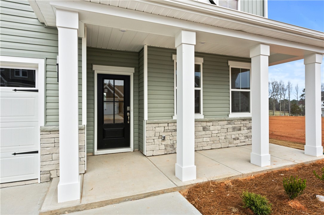 134 Anderson Oaks Lane, Unit 84 Easley, SC 29642 - Photo 5 of 43 This charming I residence features a welcoming front porch, perfect for enjoying peaceful moments outdoors.