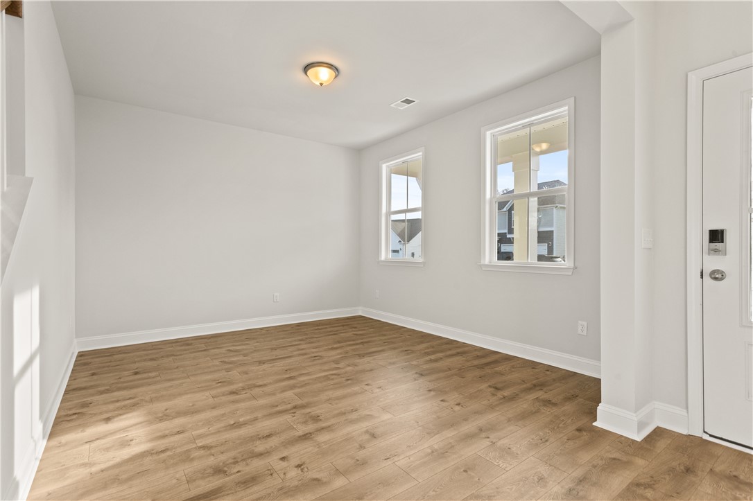 134 Anderson Oaks Lane, Unit 84 Easley, SC 29642 - Photo 7 of 43 Bright and airy living space featuring elegant flooring and abundant natural light.