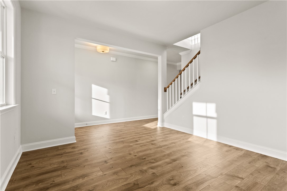 134 Anderson Oaks Lane, Unit 84 Easley, SC 29642 - Photo 8 of 43 This bright room features a beautiful wooden staircase and gleaming hardwood floors.