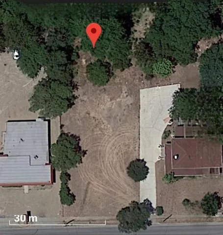 an aerial view of a house with a garden