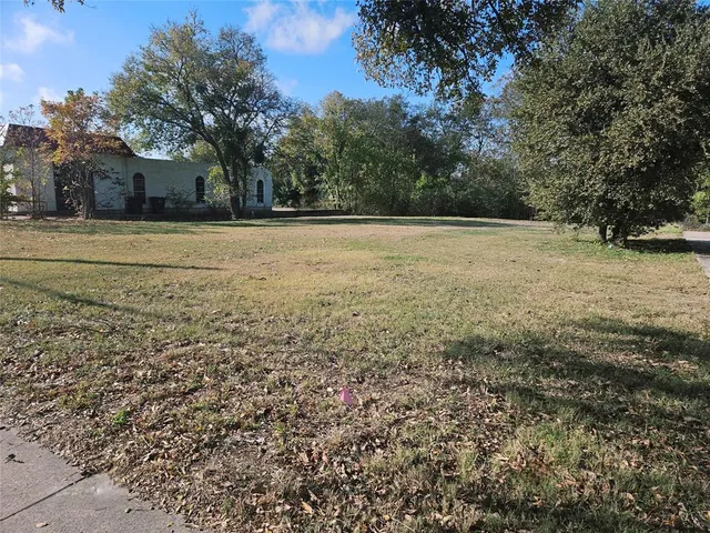 a view of outdoor space with deck and tree