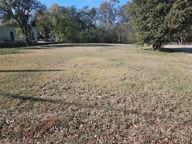 a view of swimming pool with a yard