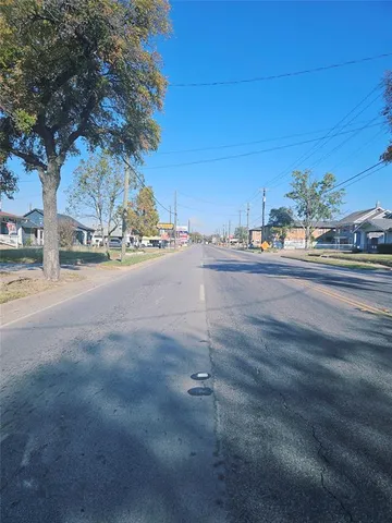 a view of a city street with a building