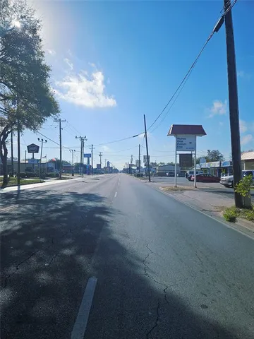 a view of a big yard with a fountain