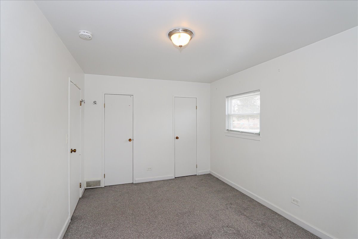 449 Elmhurst Road Mount Prospect, IL 60056 - Photo 17 of 26 a view of an empty room with a window
