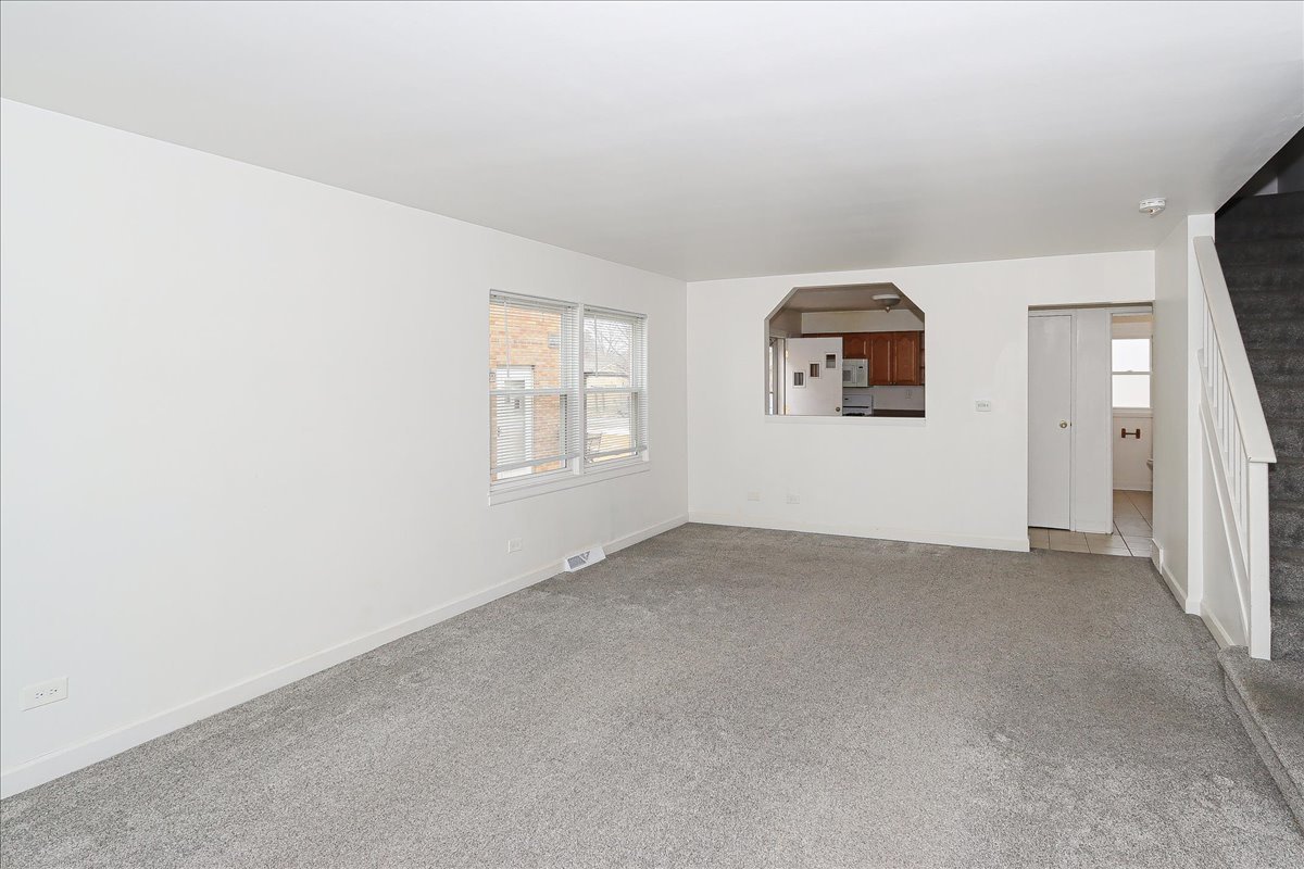 449 Elmhurst Road Mount Prospect, IL 60056 - Photo 2 of 26 an empty room with windows