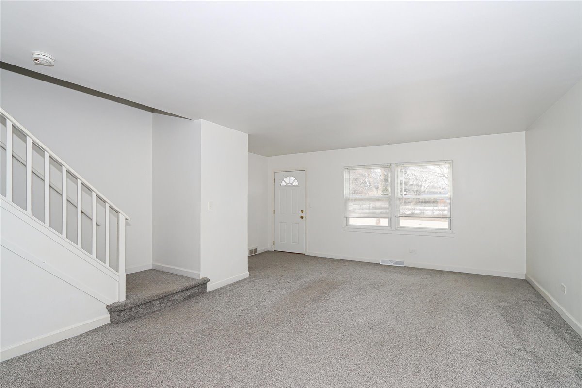 449 Elmhurst Road Mount Prospect, IL 60056 - Photo 4 of 26 an empty room with windows