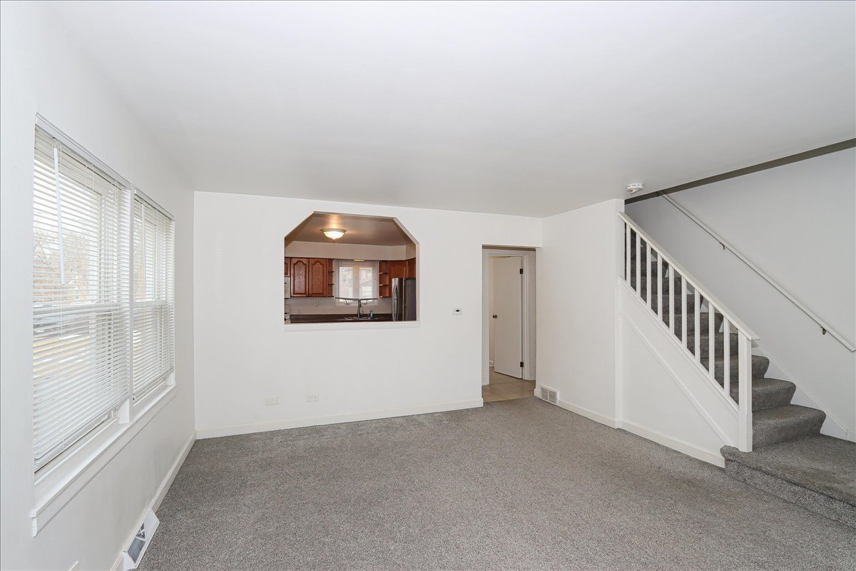 449 Elmhurst Road Mount Prospect, IL 60056 - Photo 7 of 26 a view of a livingroom with an entryway