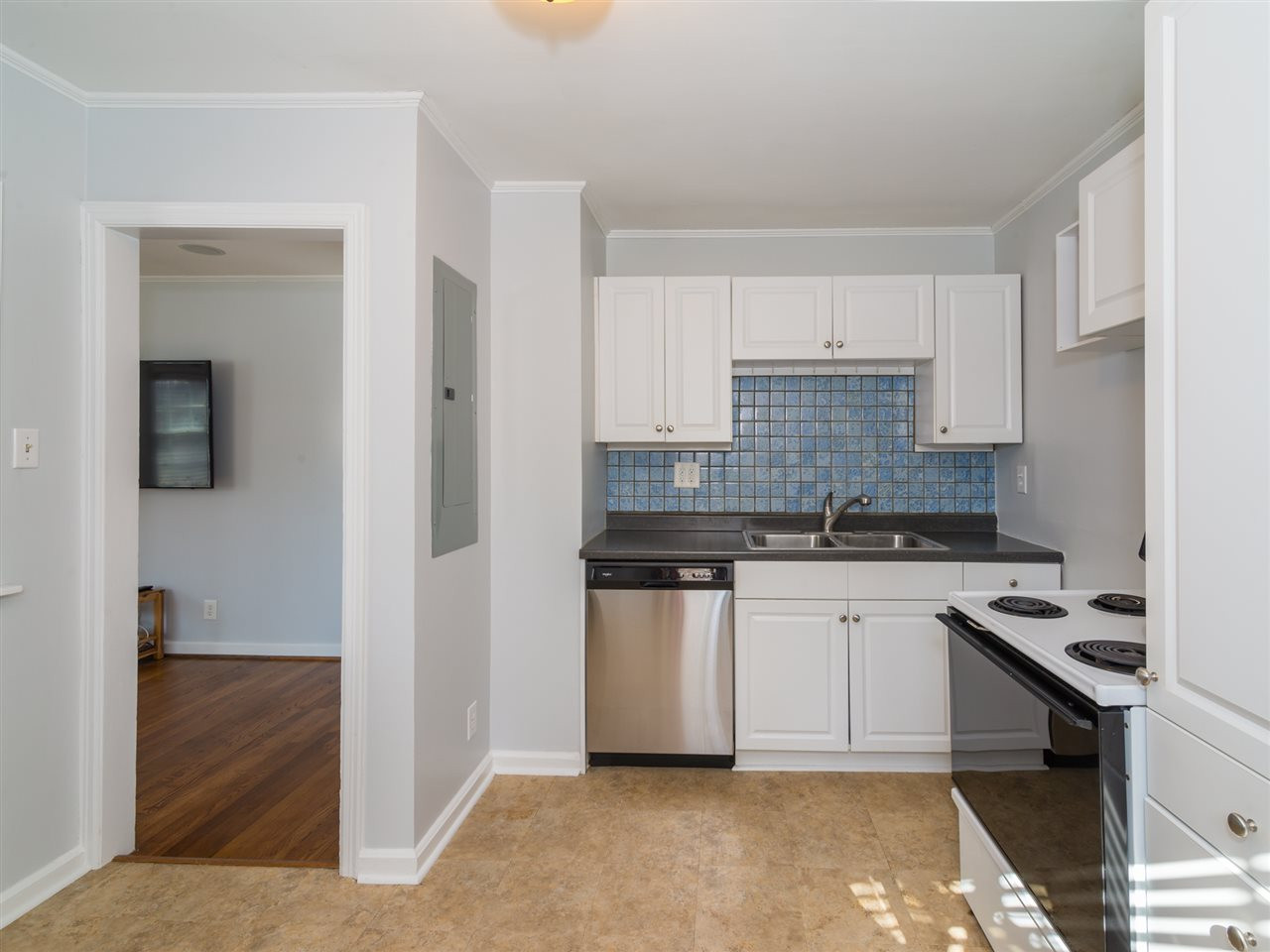 1800 Bennett Street Raleigh, NC 27604 - Photo 10 of 24 View of kitchen showing brand new dishwasher (and disposal). Doorway on left leads back to Living Room area. Kitchen