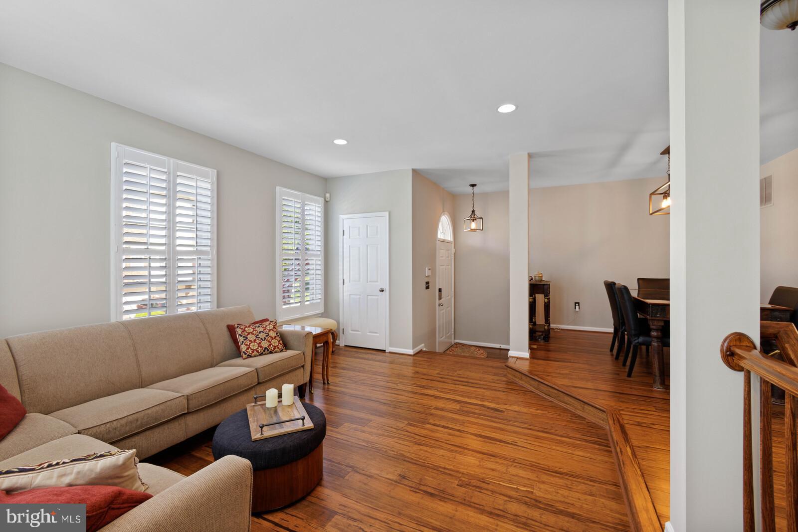 20713 Riptide Square Sterling, VA 20165 - Photo 3 of 65 a living room with furniture and a wooden floor