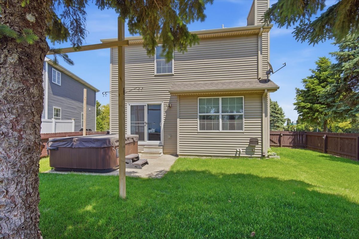 311 Old Farm Road Bloomington, IL 61704 - Photo 2 of 34 a backyard of a house with table and sofas