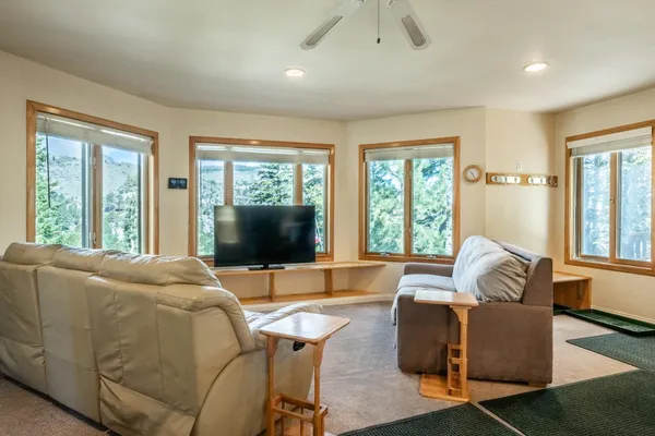 a living room with furniture and a large window