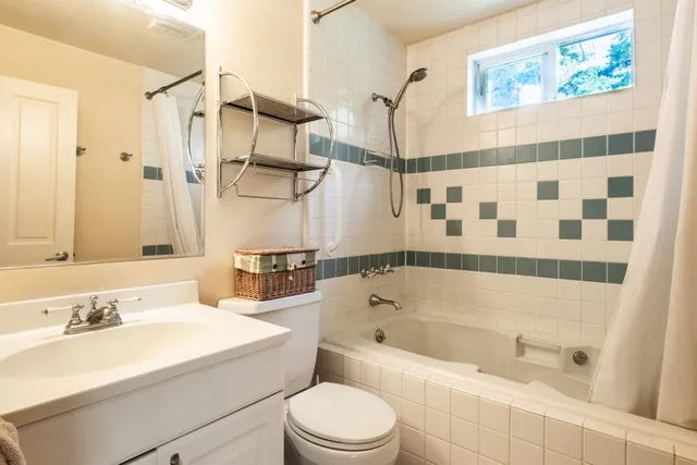 a bathroom with a sink a toilet and a bathtub