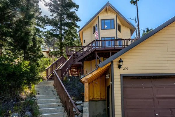 a front view of a house with wooden stairs