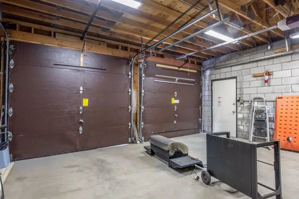 a view of a livingroom with furniture and a window