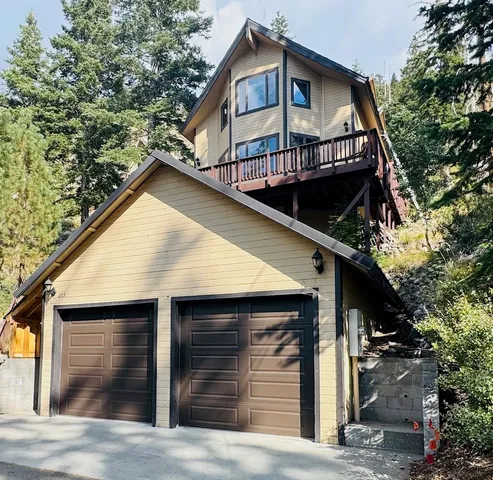 a view of a house with large windows