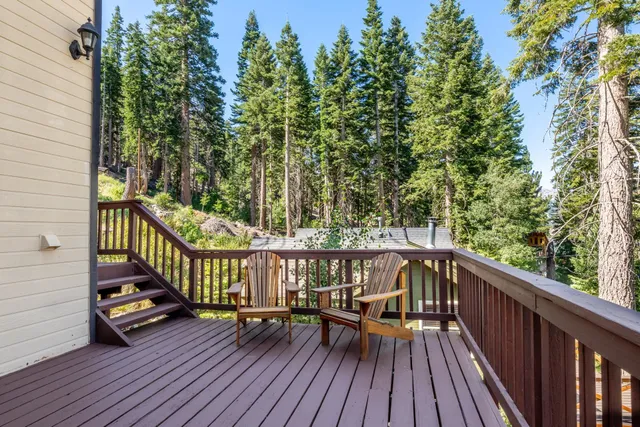 a view of balcony with deck and outdoor seating