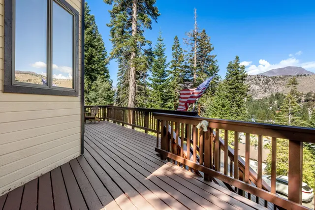 a view of a balcony with wooden floor