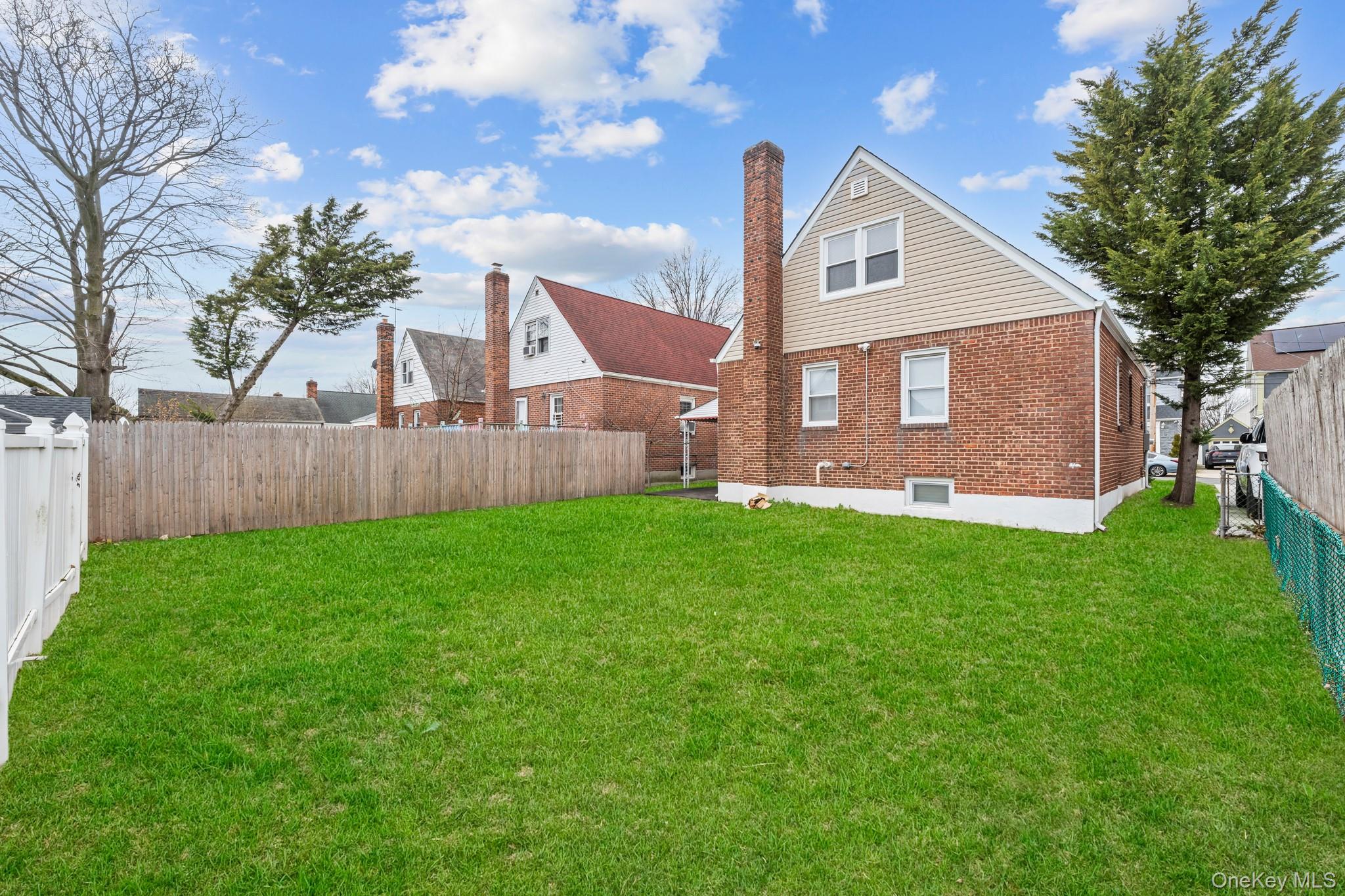 20 Dewitt Street Valley Stream, NY 11580 - Photo 11 of 13 a front view of a house with garden