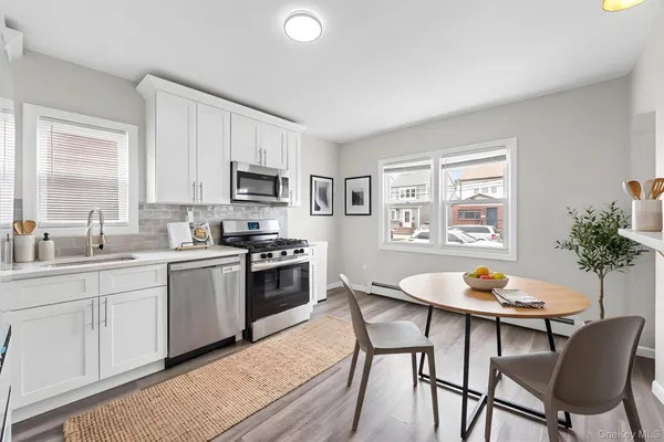 a kitchen with a dining table and chairs