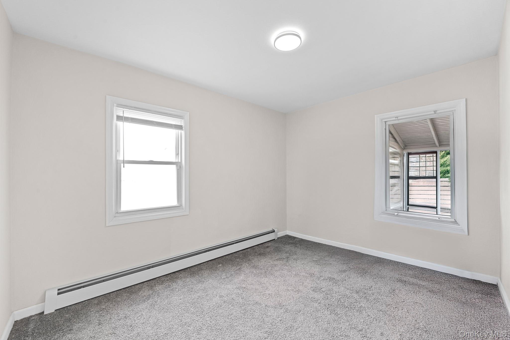 20 Dewitt Street Valley Stream, NY 11580 - Photo 6 of 13 an empty room with a window
