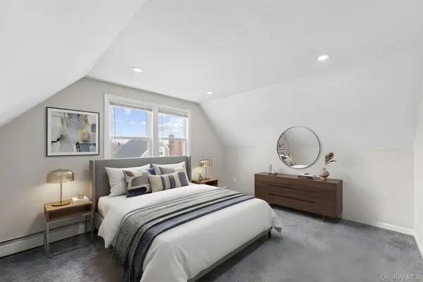 a bedroom with bed and window