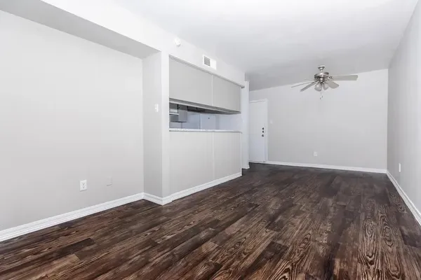 a kitchen with cabinets appliances a sink and a stove