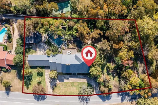 an aerial view of houses with yard