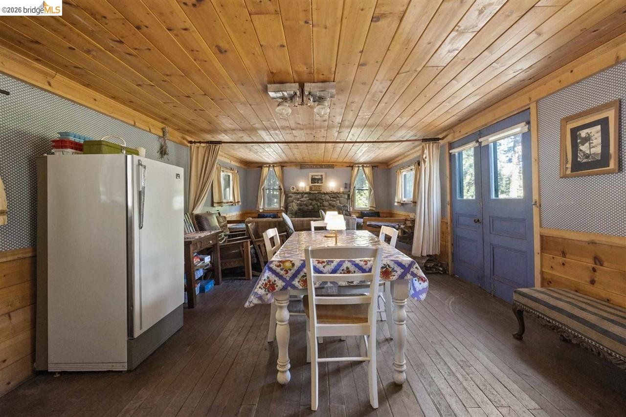 7 Riverside Tract Kyburz, CA 95720 - Photo 8 of 25 a view of a dining room with furniture window and wooden floor