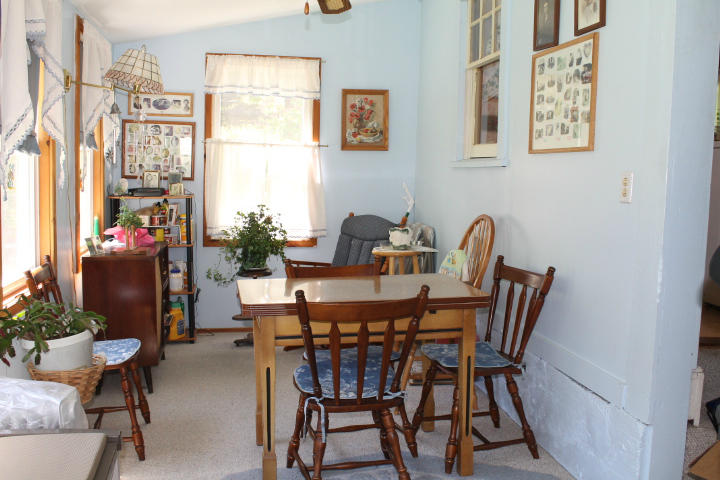 2840 Hancock Road Hancock, MA 01267 - Photo 5 of 9 a view of a dining room with furniture and a window