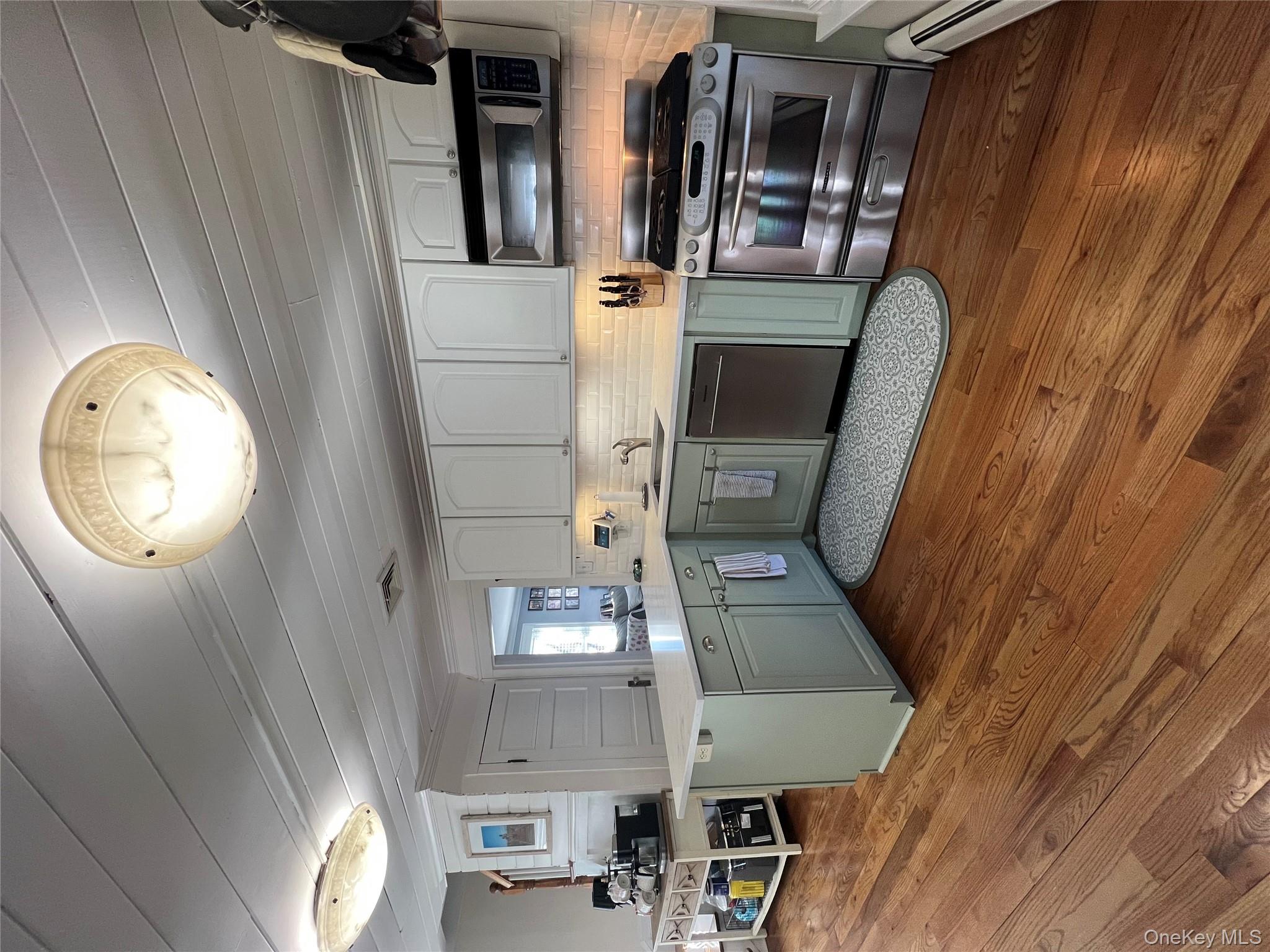 22 High Street Garnerville, NY 10923 - Photo 12 of 49 a kitchen with stainless steel appliances a stove a sink and a microwave