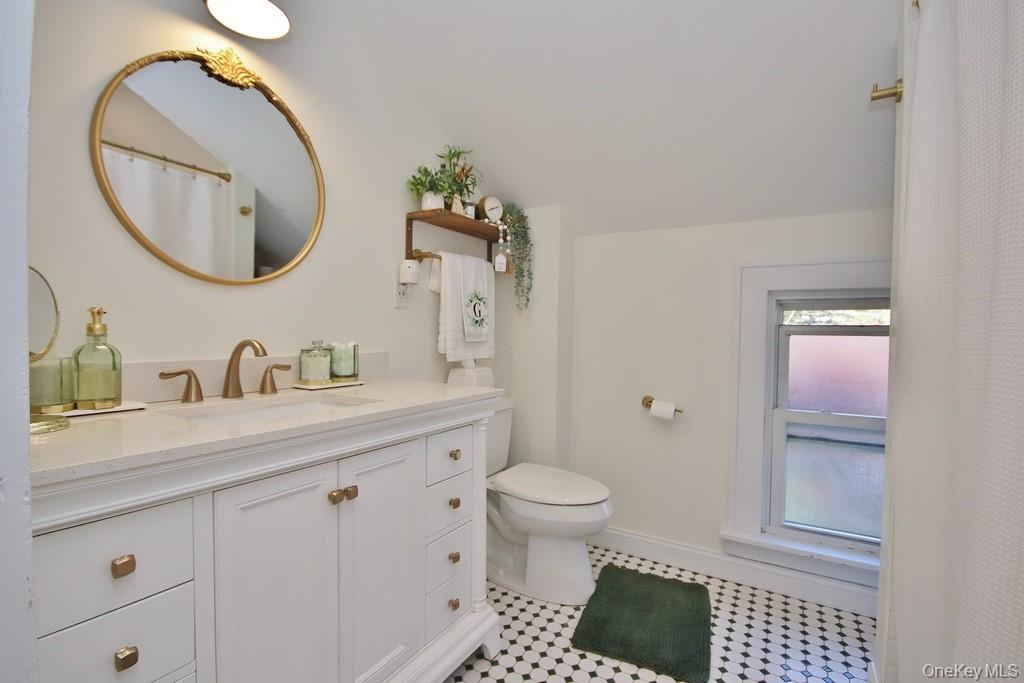 22 High Street Garnerville, NY 10923 - Photo 23 of 49 a bathroom with a sink a toilet and a mirror